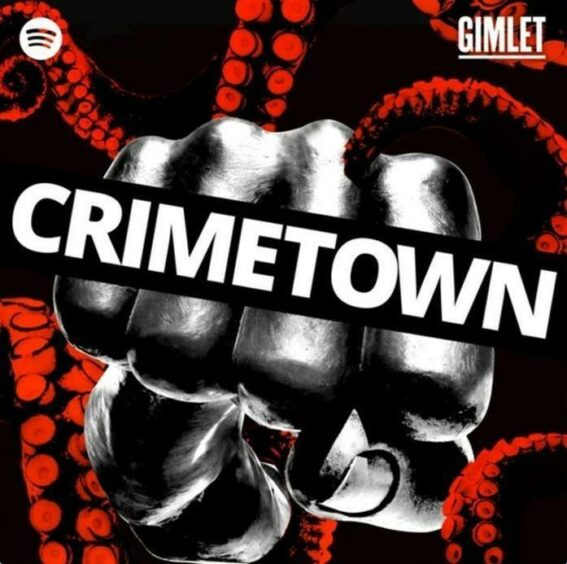 A fist coming at the camera with the word "Crimetown" printed across the knuckles