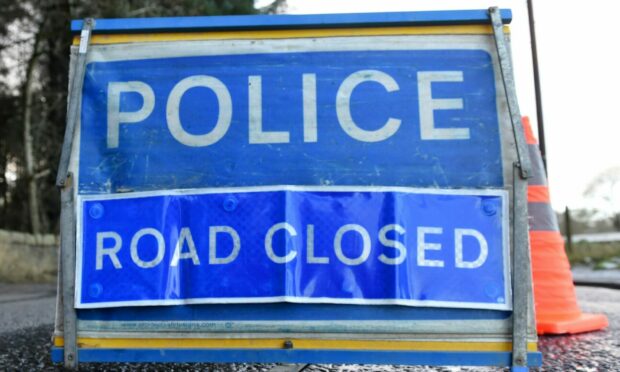 A section of the A93 was closed following a crash.
