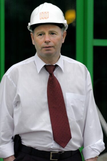 Mr Milne sporting a hard hat in 2004.
