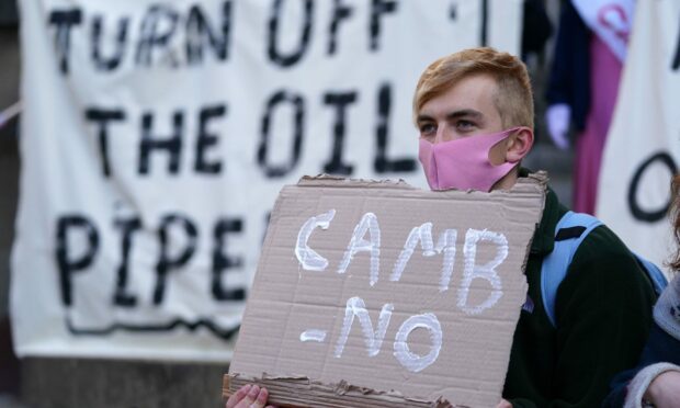 Protester holding Camb-no sign in protest to Cambo oil field.