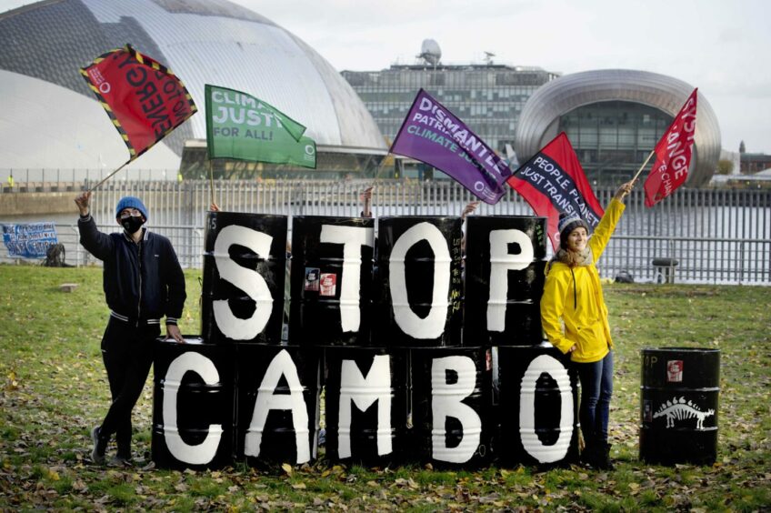 Campaigners spraypainted and stacked barrels to read Stop Cambo.