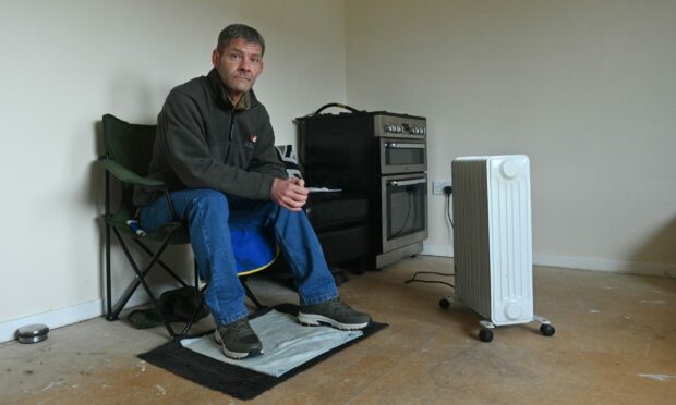 Brian Beatens has endured months with no carpet on the floor of his Buckie home. Photo by Jason Hedges/DCT Media