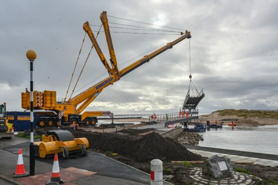 The work on the new Lossiemouth East Beach Bridge was delayed today - because the crane wasn't quite long enough. Pictures by JASON HEDGES/DCT Media