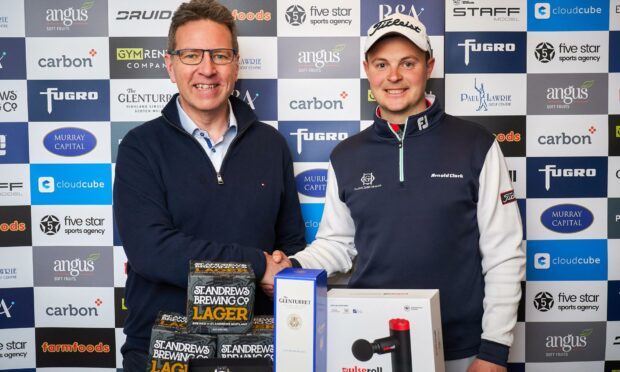 Carbon Financial managing director Gordon Wilson congratulates Jack McDonald on his £4,000 Blairgowrie Perthshire Masters win. Pic Fraser Band Photography