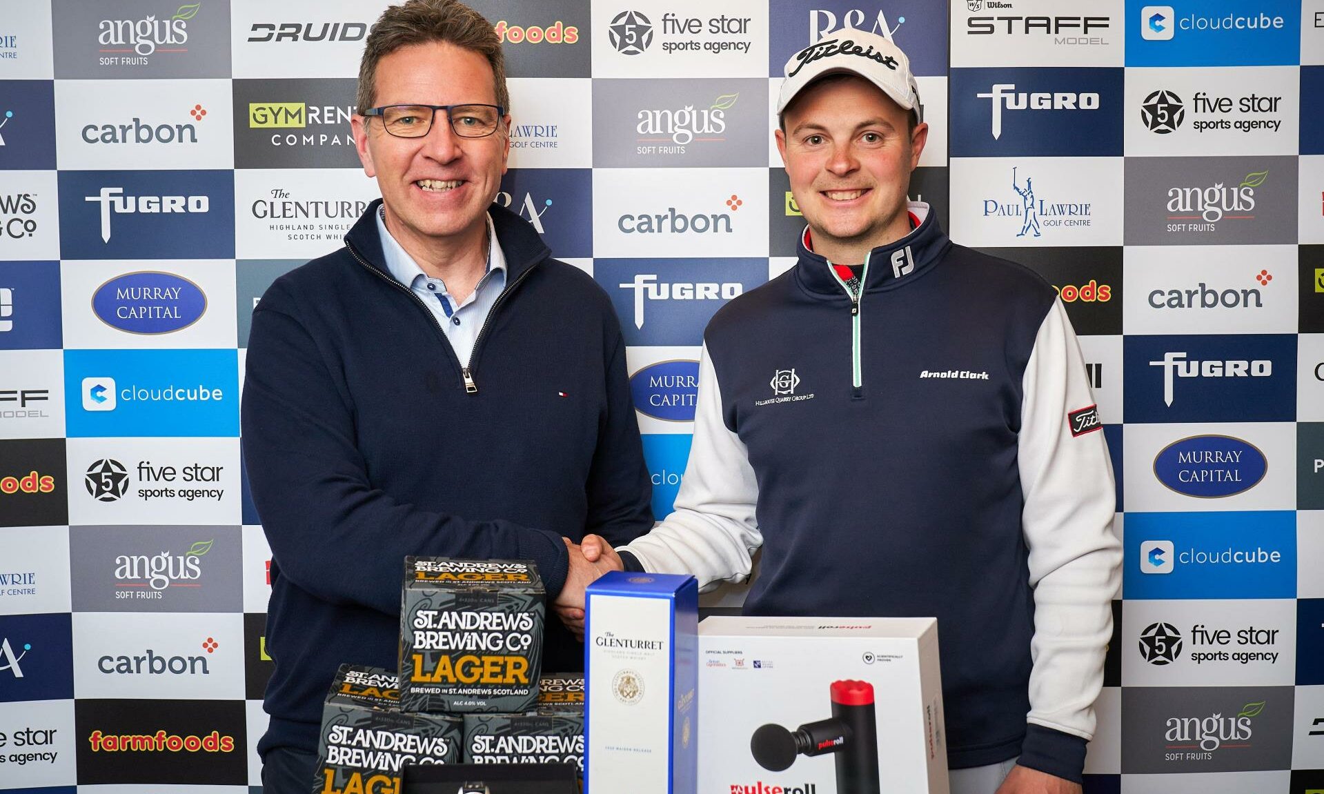 Carbon Financial managing director Gordon Wilson congratulates Jack McDonald on his £4,000 Blairgowrie Perthshire Masters win. Pic Fraser Band Photography