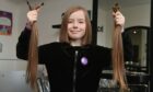 Kaycee Mae Wells has raised over £1,000 for the charity Little Princess Trust after getting sponsored to cut her hair. Picture by Kenny Elrick.