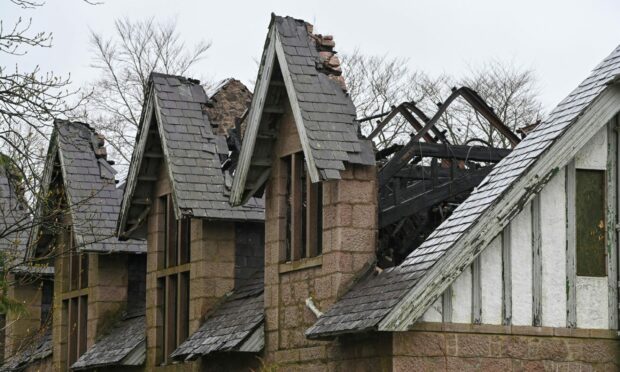 The fire was mostly in the roof of the building. Picture by Kenny Elrick.