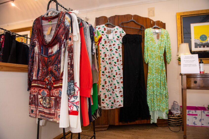 Colourful clothes hanging in Livi Loves.