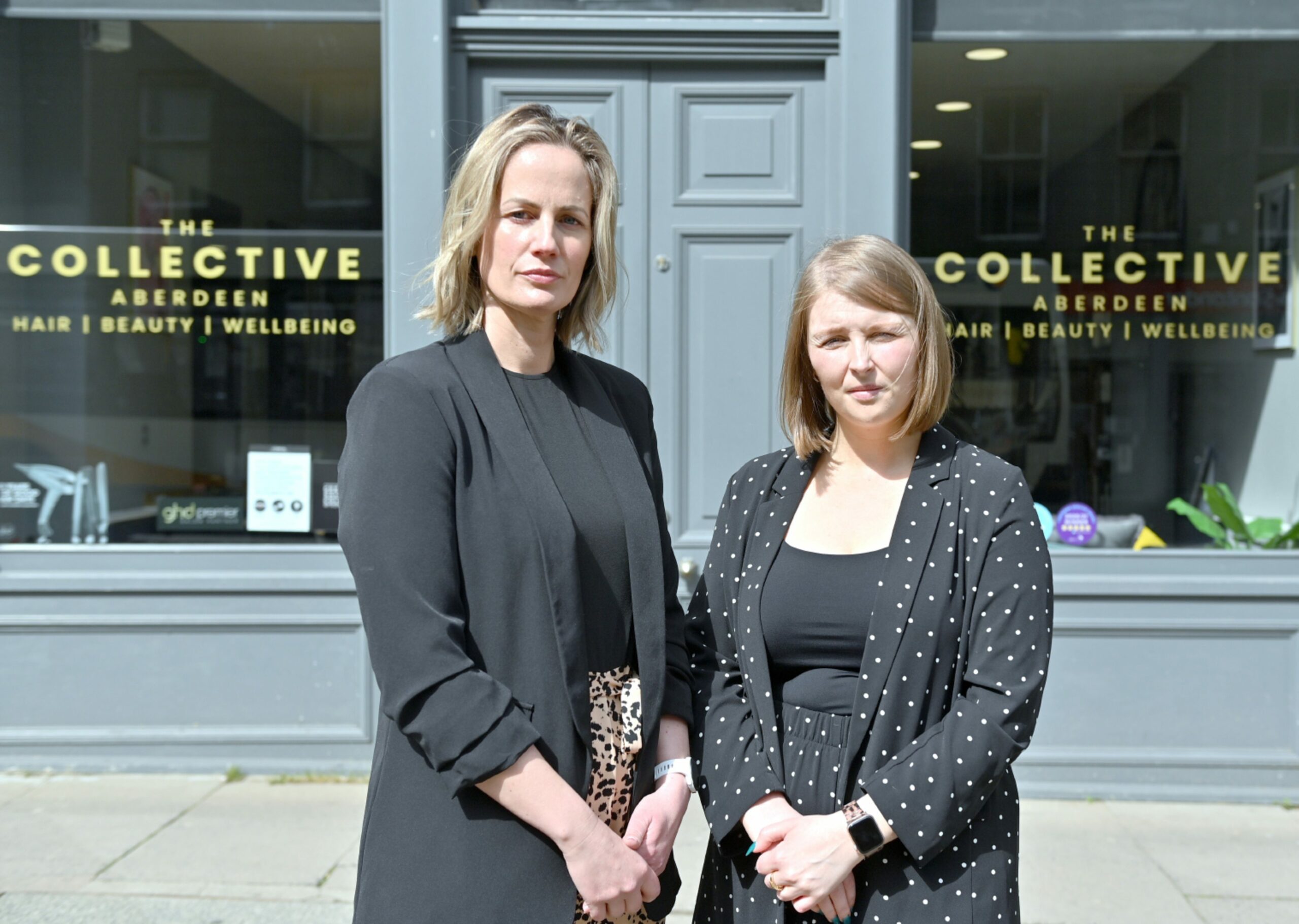 Julie Hulcup and Courtney Forbes in front of The Collective hair salon.