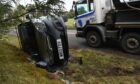 Vehicle on its side near Ardoe House hotel on the B9077. Picture by Kami Thomson.