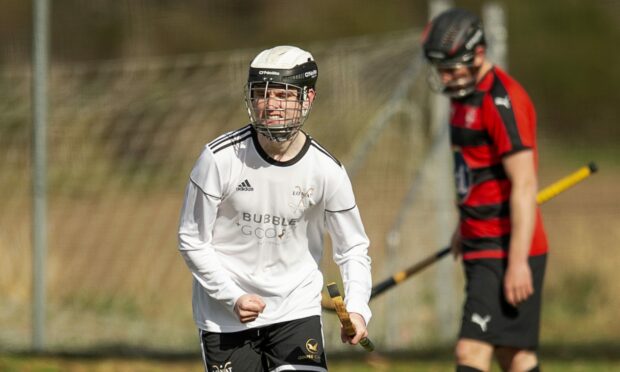 Lovat's Graeme MacMillan celebrates getting the only goal of the game against Oban Camanachd.