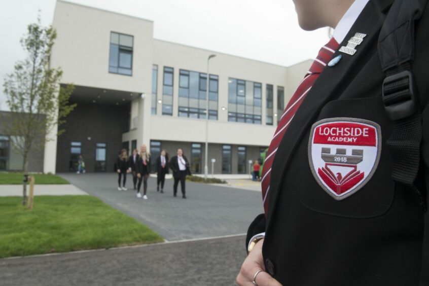 Lochside Academy and the school badge on a blazer worn by a pupil