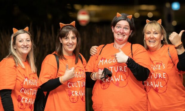 Four Culture Crawl walkers smiling with their thumbs up