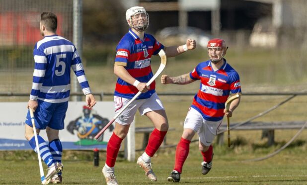 Roddy Young celebrates a goal for Kingussie against arch-enemies Newtonmore. Image: Neil G Paterson