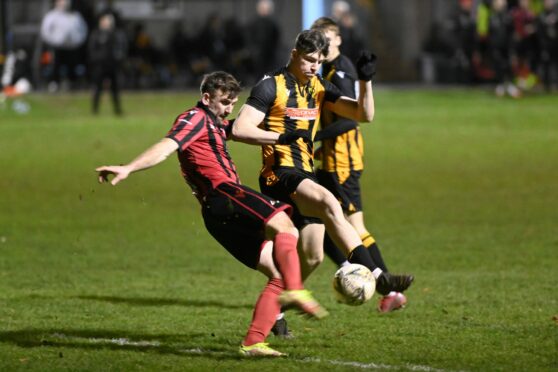 Fergus Alberts, right, in action for Huntly. Image: Paul Glendell/DC Thomson