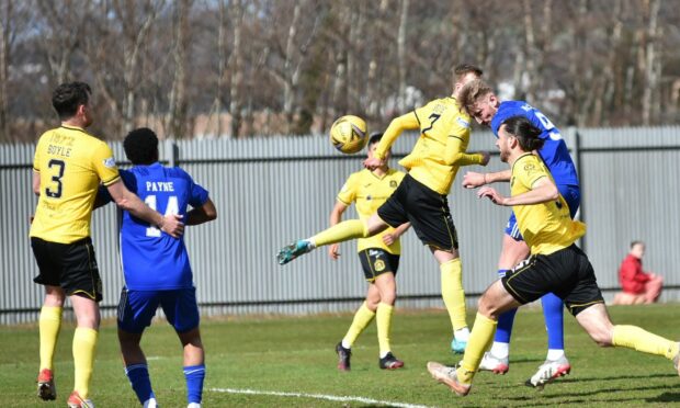 Peterhead's Russell McLean heads home the equaliser against Dumbarton.