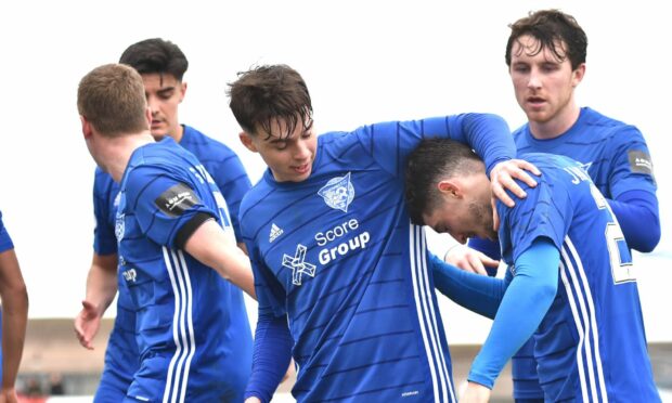 Jack Brown is congratulated by Peterhead team-mates after his goal against Falkirk