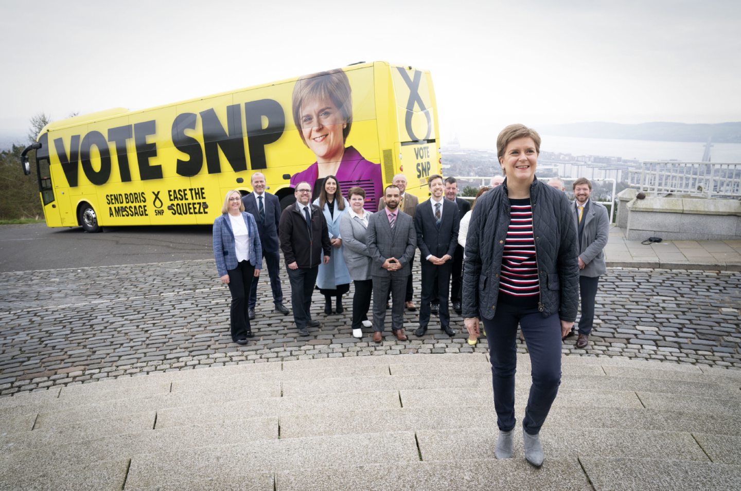 First Minister Nicola Sturgeon with candidates and party supporters at Dundee Law in Dundee at the launch for the SNP's campaign bus, which will tour Scotland in the 21 days before the local elections. Picture date: Friday April 15, 2022.  Jane Barlow/PA Wire