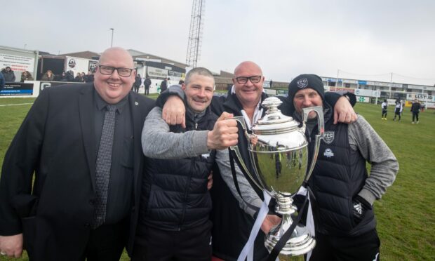 From left to right: Fraserburgh chairman Finlay Noble, manager Mark Cowie, vice-chairman Peter Bruce and assistant manager James Duthie with the Highland League championship trophy.