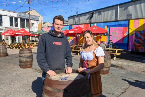 Rory Masson and bar manager Jo Mair at the Bike Yard last summer. Its 2022 comeback has been thrown into doubt... Picture by Scott Baxter.