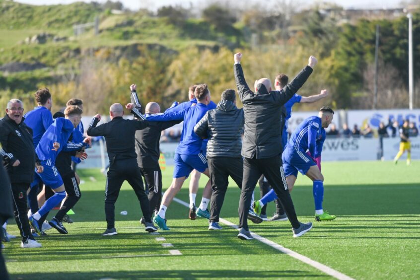 Cove Rangers players and staff celebrate Mitch Megginson's goal