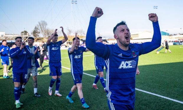 Cove Rangers midfielder Connor Scully celebrates their title win