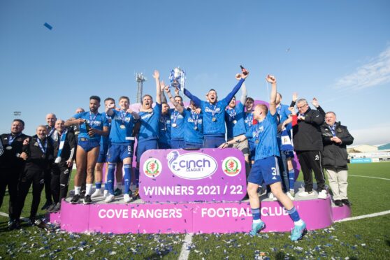 Cove Rangers players celebrate with the League One title