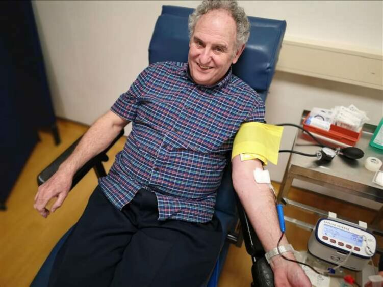 Billy McCook, from Elgin, donating blood.