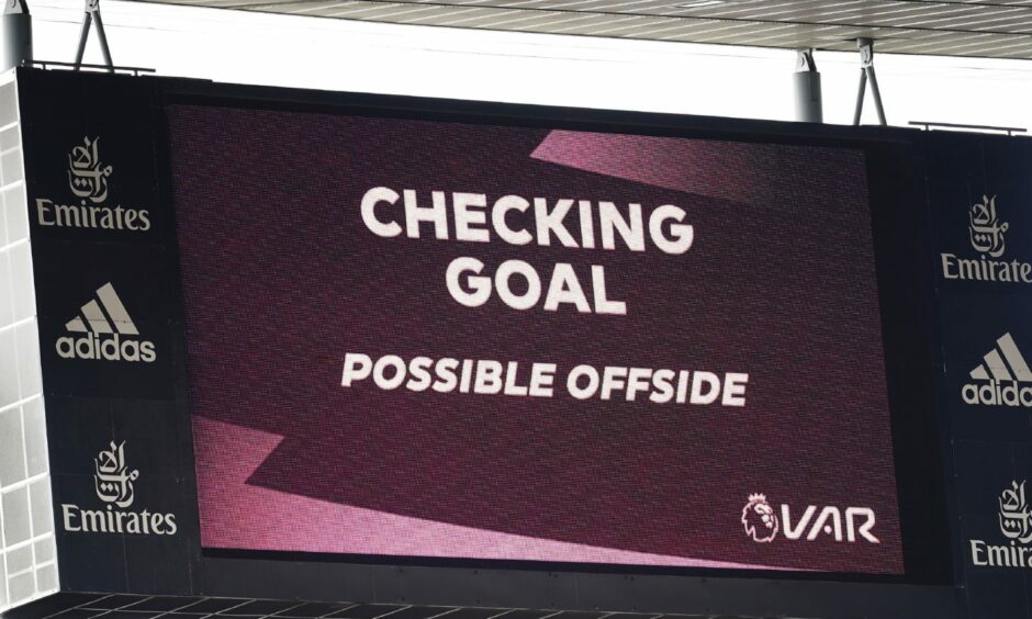 VAR screen reads "checking goal possible offside".