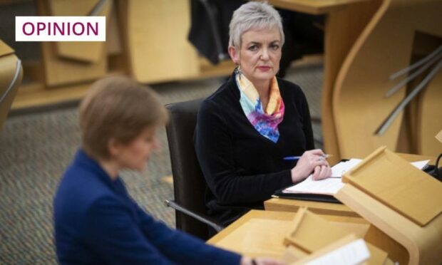 Scotish drugs minister Angela Constance looks on as First Minister Nicola Sturgeon speaks in Holyrood (Photo: PA)