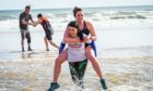 Gayle joins a military fitness session on Balmedie beach and gets stuck in giving Pamela Dawson a piggyback. Picture: Wullie Marr.