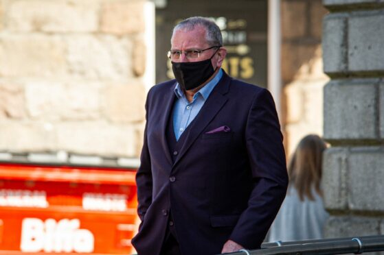 Ian Stuart, pictured leaving Aberdeen Sheriff Court, alleges he was threatened by Stuart Allan.