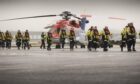 Oil and gas workers at Aberdeen heliport.