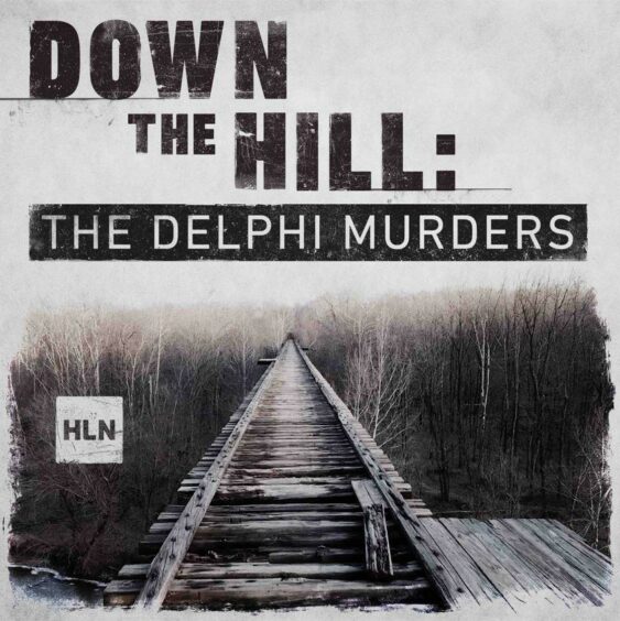 A disused railway bridge stretches into the distance with the tops of trees on a level with the track. Text reads: "Down the Hill, the Delphi Murders" 