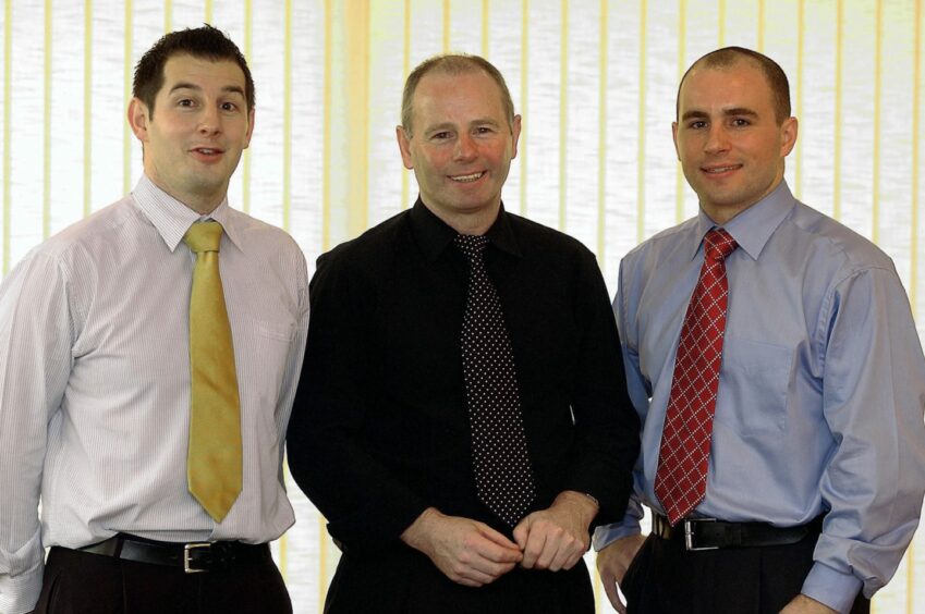 Mr Milne centre, with sons Gary, right, and Mike in the boradroom of Stewart Milne's Westhill HQ in 2003.