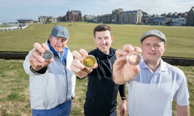 l-r Bonnie Wee Golf managing director Dave Harris, tour specialist Cam Howe and director Stew Morrison show off commemorative coins golfers can get on the Old Tom Morris Trail.