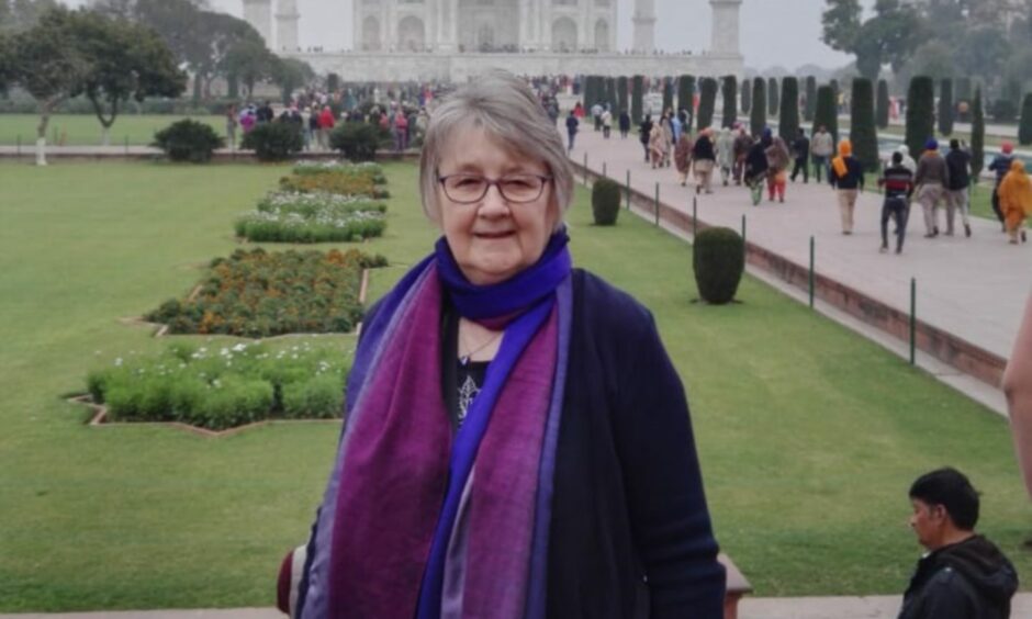 a picture of Karina Smith showing her standing in the gardens of the Taj Mahal