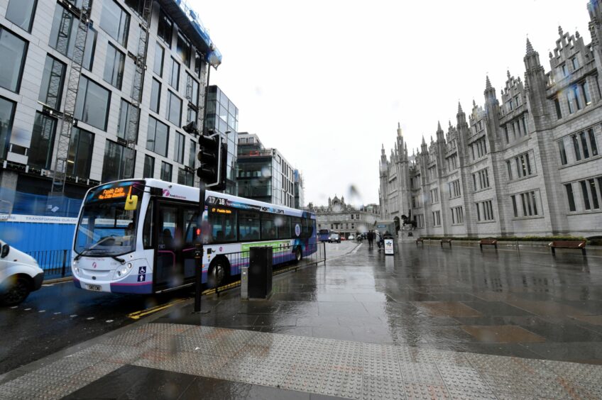 A bus passes Aberdeen City Council HQ at Marischal College, Broad Street. Picture by Jim Irvine/DCT Media.
