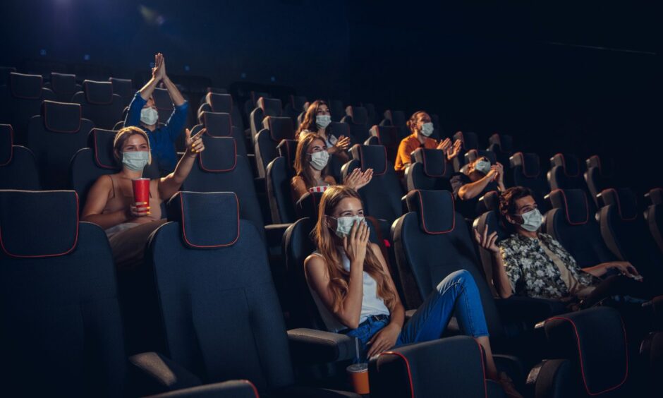 Cinema audience wearing face masks 