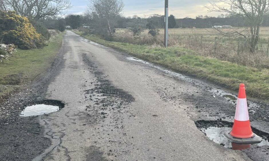 Road with potholes.