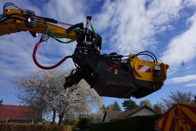 Highland pothole machine repairs a road