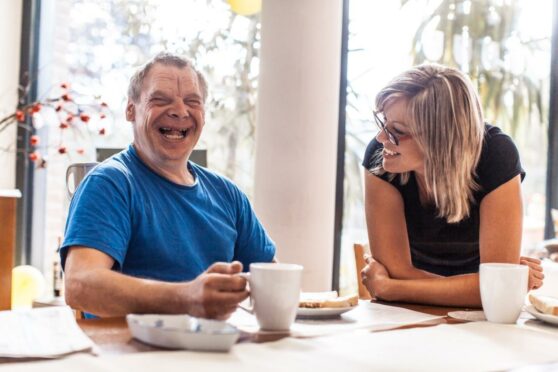 woman with a job as social care worker with a service user