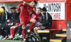Aberdeen's Christian Ramirez kicks some water bottles after being substituted against Dundee.