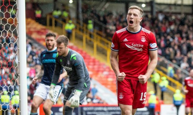 Aberdeen's Lewis Ferguson celebrates scoring the winner against Dundee.