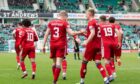 Aberdeen celebrate David Bates' goal in 1-1 draw with Hibs.