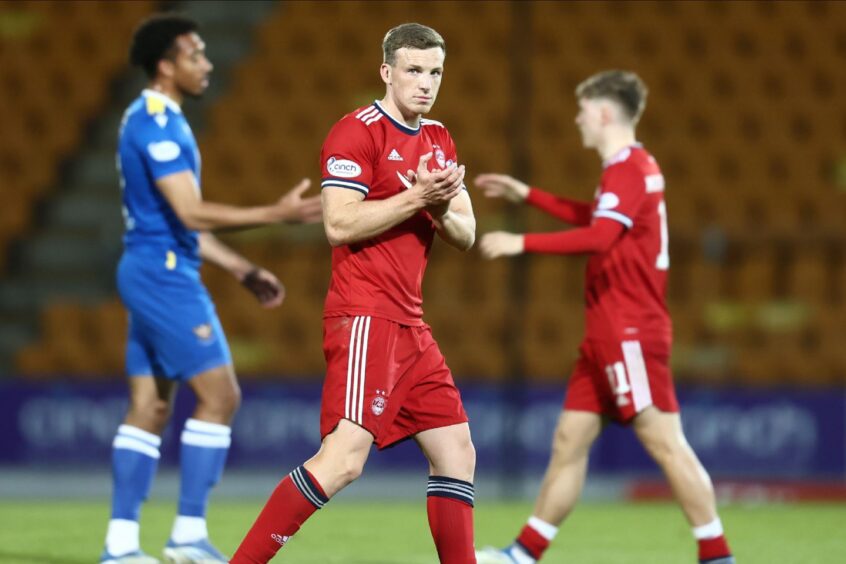 Aberdeen's Lewis Ferguson clapping on the pitch