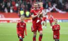 Aberdeen's Andy Considine (4) applauds the fans as he leaves the Pittodrie pitch for the last time.