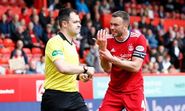 Aberdeen's Andrew Considine calls for hand-ball in the 0-0 draw with St Mirren.