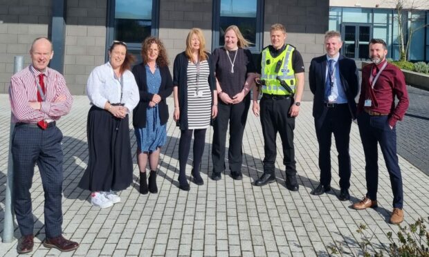 Constable Harry Jackson with staff at Aberdeen's Lochside Academy.
