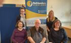 Margaret Grant (fundraising coordinator), Sarah Southcott (administrator), Bill Whyte (volunteer and BHL ambassador), Jo Page (board director) and Susan White (executive director) at Befrienders Highland.
